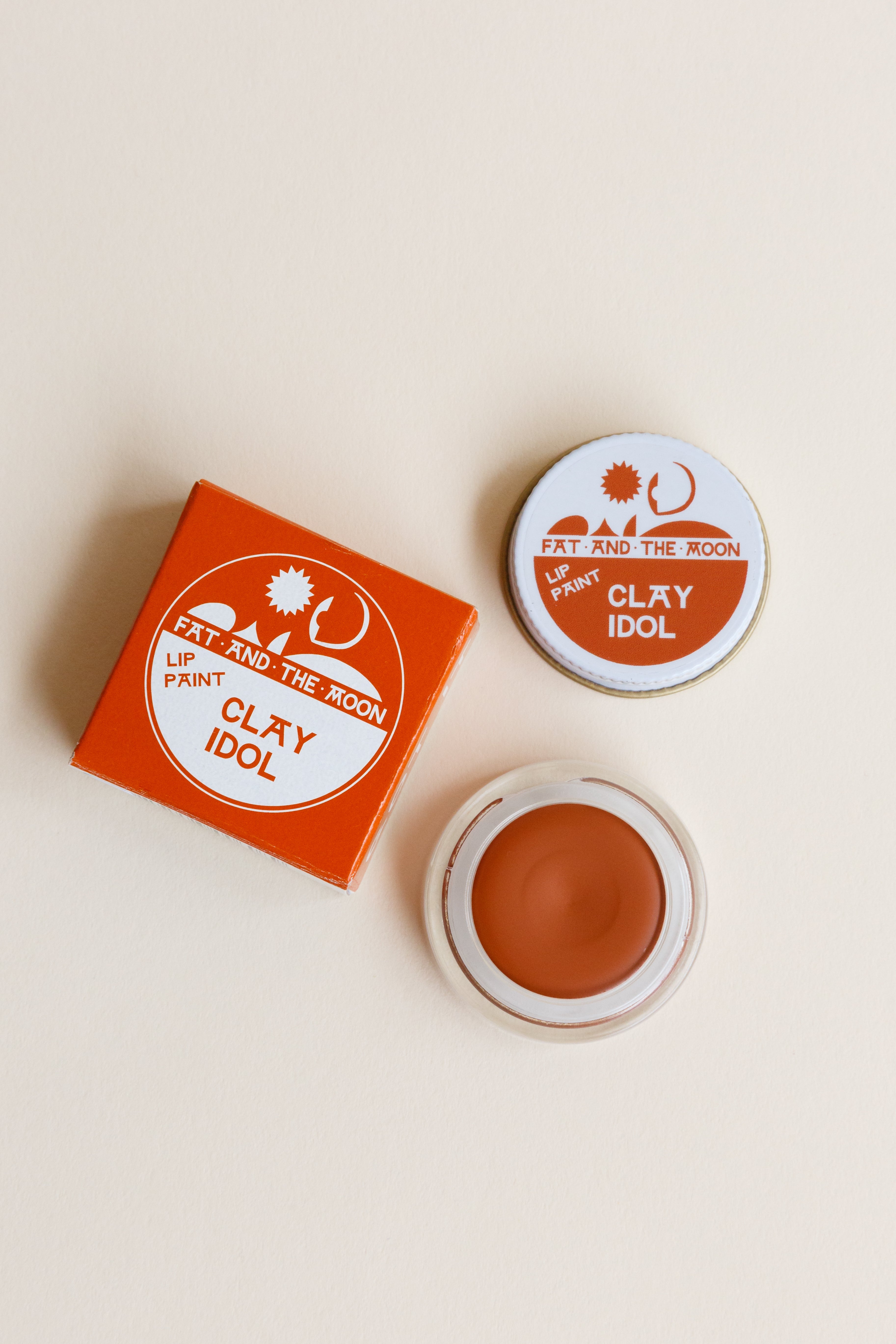 A jar of Fat and the Moon Lip Paint in Clay Idol color