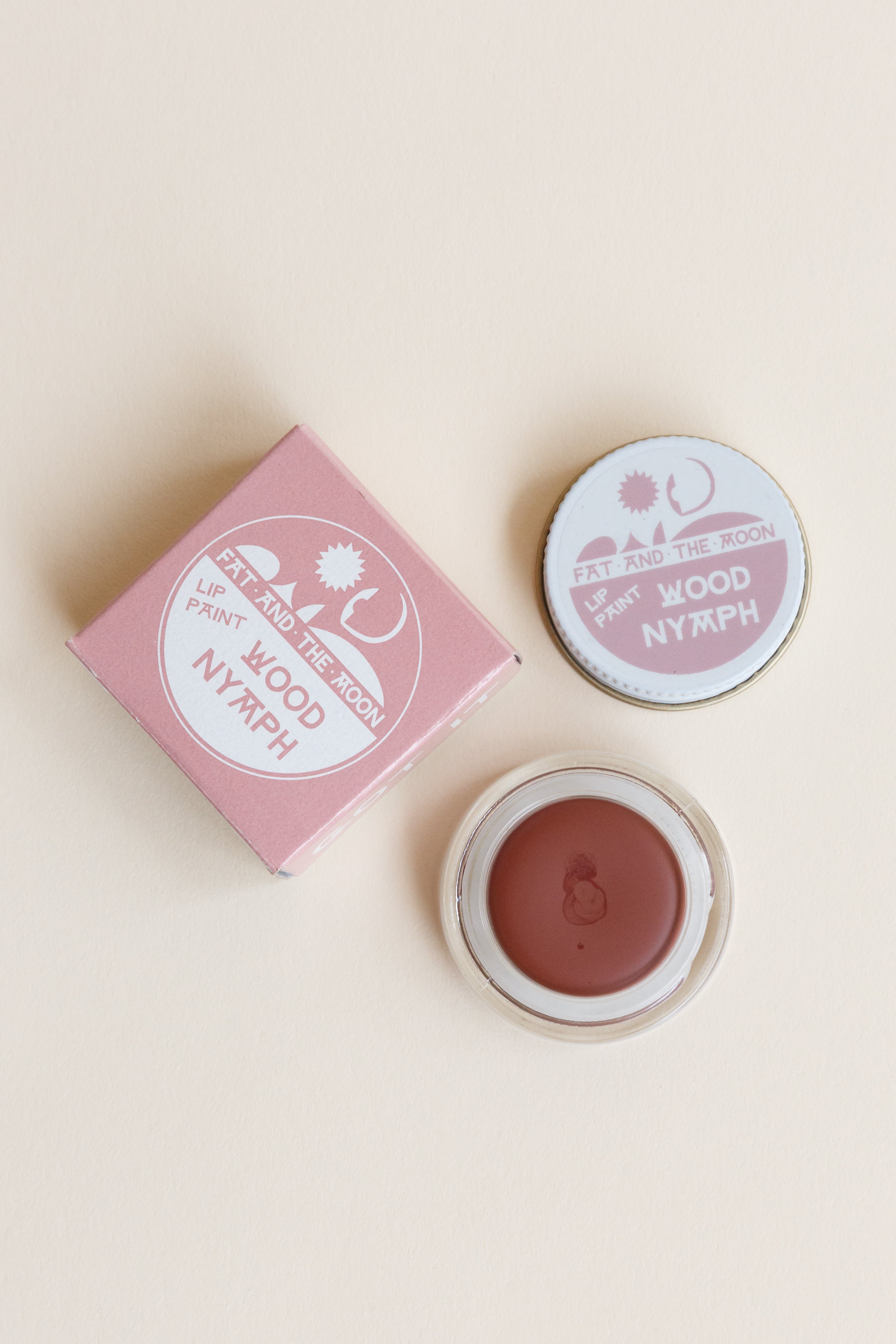 A jar of Fat and the Moon Lip Paint in Wood Nymph color